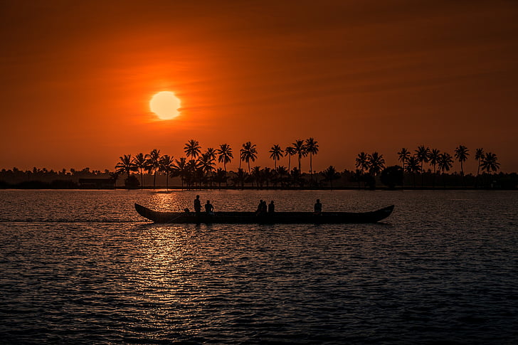 silhouette of canoe during sunset