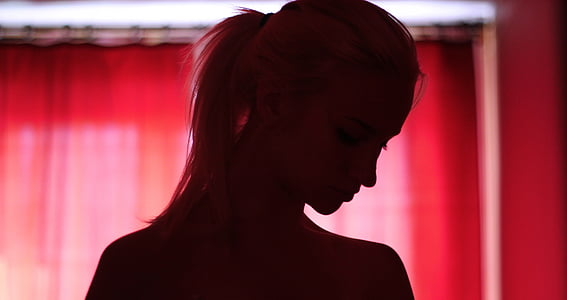 silhouette of woman in pony tail