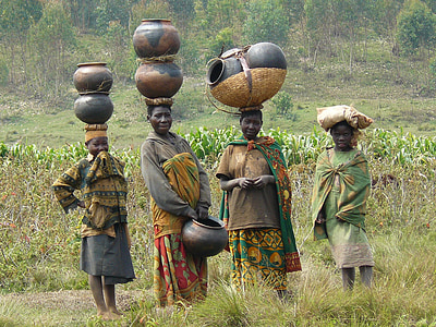four women with jars on their head