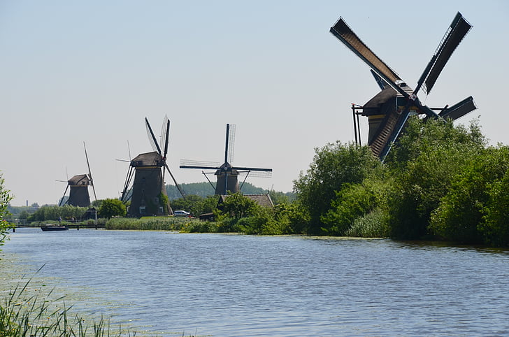 landscape photography of four windmills