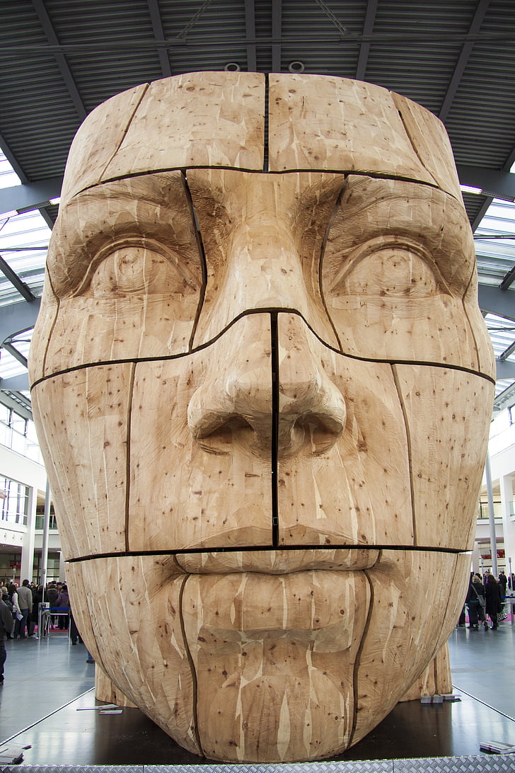 brown wooden statue of man's face