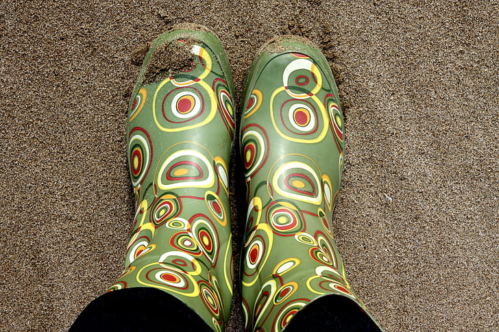 pair of green-and-brown rain boots