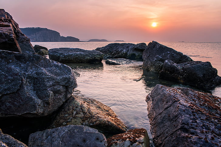 rocky shore during sundown