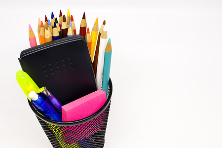 assorted-color colored pencils on black mesh can