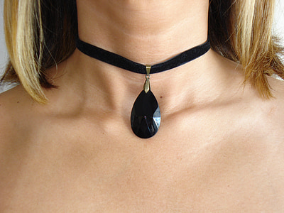 woman wearing black choker necklace