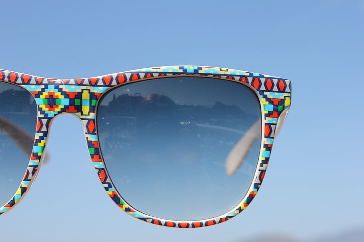 red, blue, and yellow framed Wayfarer-style sunglasses