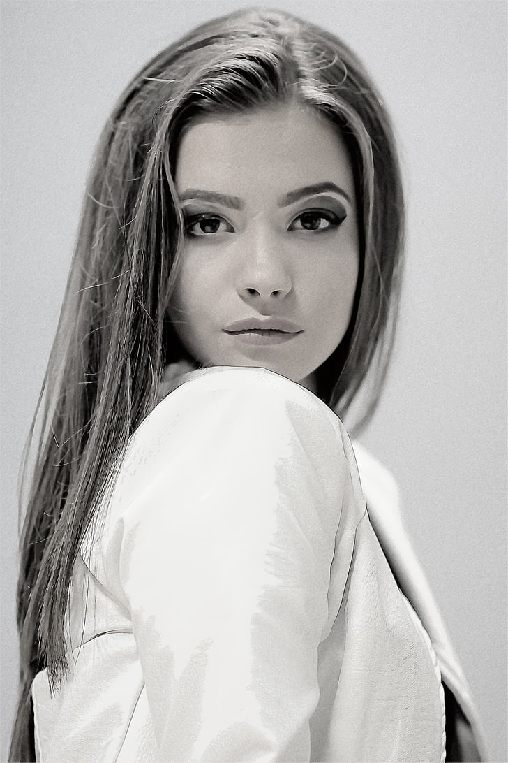 grayscale photo of girl wearing jacket