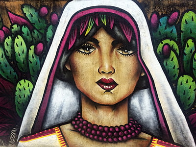 woman with white hijab painting