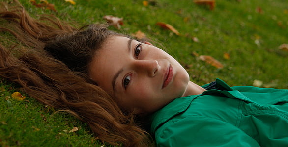 woman lying on grass