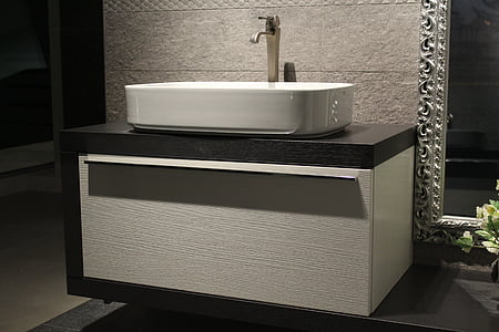 white ceramic sink with silver faucet