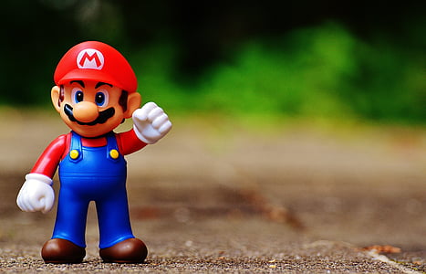 shallow focus photography of Mario toy