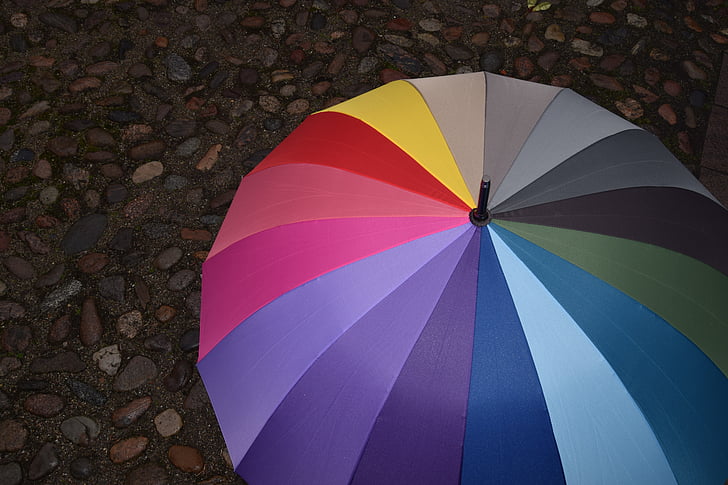 multicolored umbrella photo during daytime